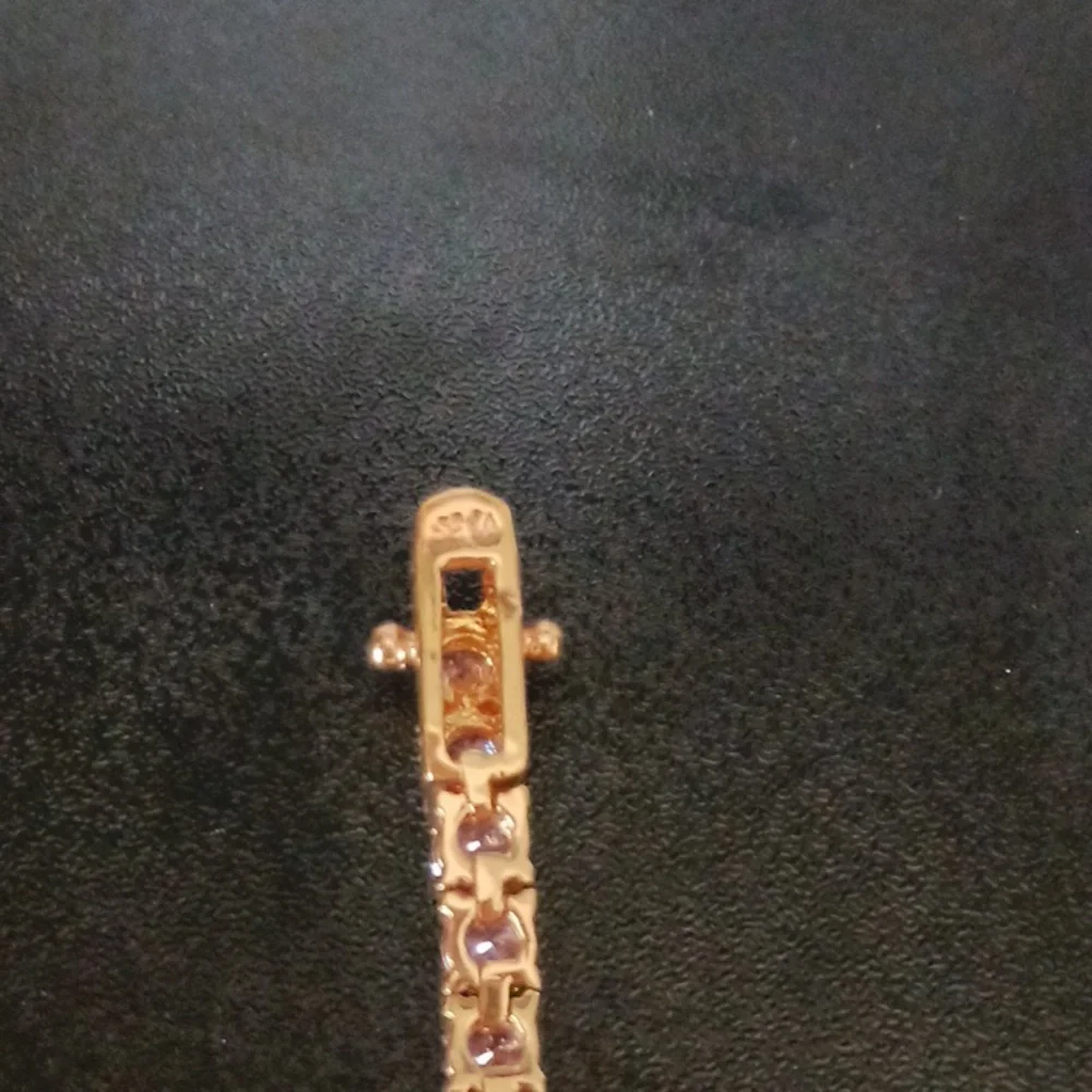 Elegant Gold Tone Bracelet with Pink Stones